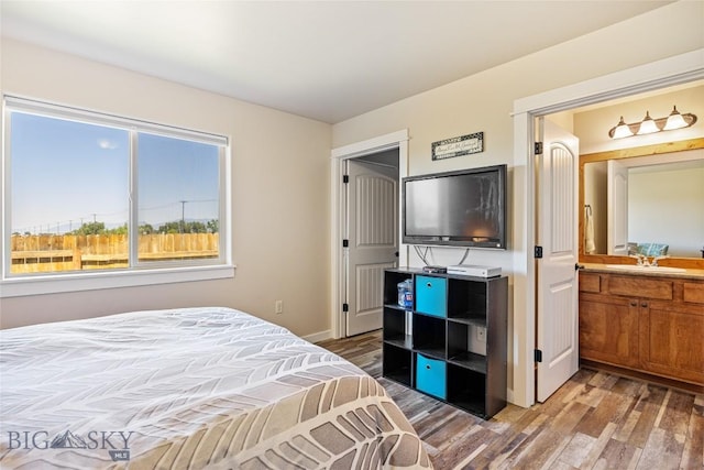 160 Tail Feather Ln Unit D, Bozeman, MT 59718 - bedroom featuring wood finished floors and a sink