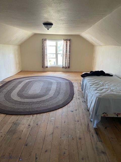 619 Daly St W, Walkerville, MT 59701 - bedroom with vaulted ceiling and hardwood / wood-style floors