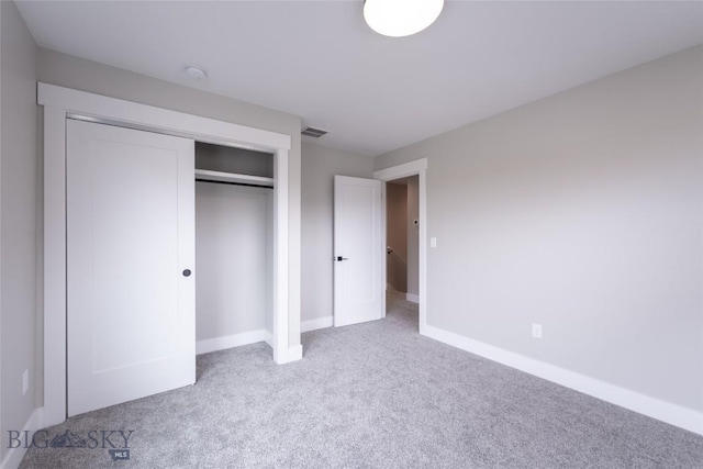 740 Rogers Way Unit B, Bozeman, MT 59718 - unfurnished bedroom featuring carpet and a closet