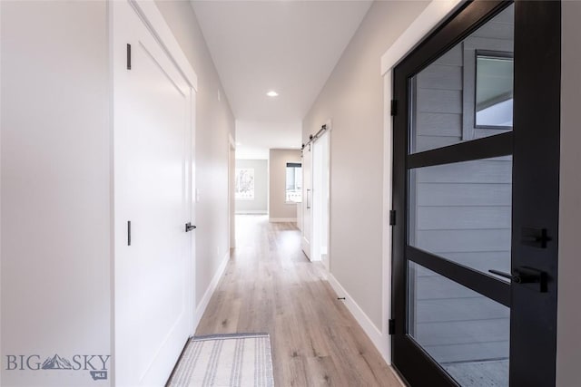 740 Rogers Way Unit B, Bozeman, MT 59718 - corridor featuring a barn door, light wood-style floors, and recessed lighting