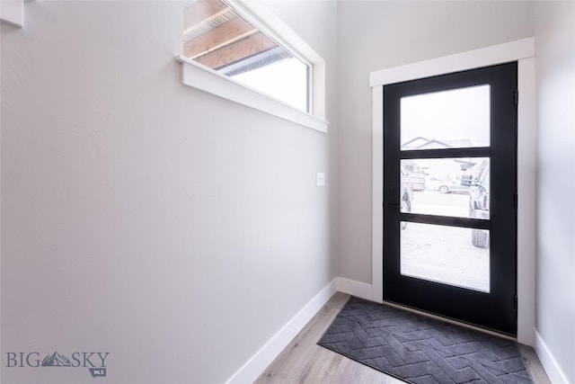 740 Rogers Way Unit B, Bozeman, MT 59718 - entryway with baseboards and wood finished floors