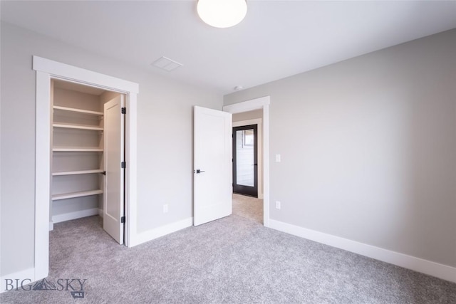740 Rogers Way Unit B, Bozeman, MT 59718 - unfurnished bedroom featuring carpet floors and a spacious closet