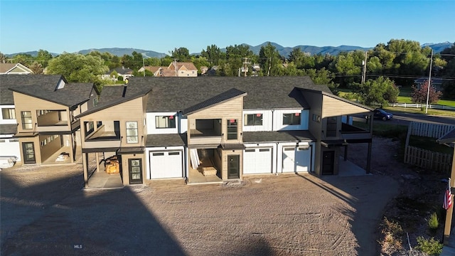 740 Rogers Way Unit B, Bozeman, MT 59718 - view of property with a garage, driveway, and a mountain view