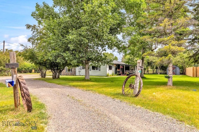 2 Harris Pl, Livingston, MT 59047 - view of front of house with dirt driveway and a storage shed