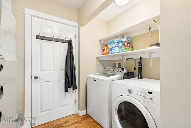 2 Harris Pl, Livingston, MT 59047 - laundry room featuring washer and dryer and light wood-style flooring
