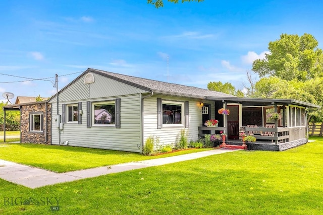2 Harris Pl, Livingston, MT 59047 - view of front of home featuring a front lawn and a sunroom
