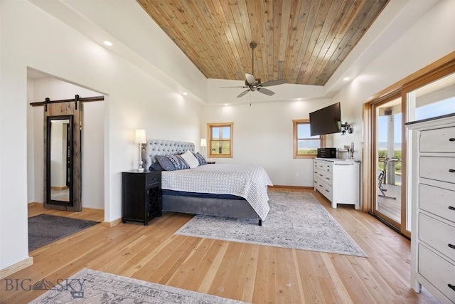 915 Point Of Rocks Rd, Whitehall, MT 59759 - bedroom with a barn door, wood ceiling, light wood-type flooring, access to outside, and lofted ceiling