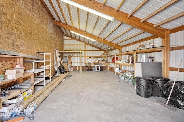 915 Point Of Rocks Rd, Whitehall, MT 59759 - miscellaneous room with high vaulted ceiling, unfinished concrete flooring, and metal wall
