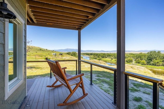 915 Point Of Rocks Rd, Whitehall, MT 59759 - wooden terrace with a water and mountain view