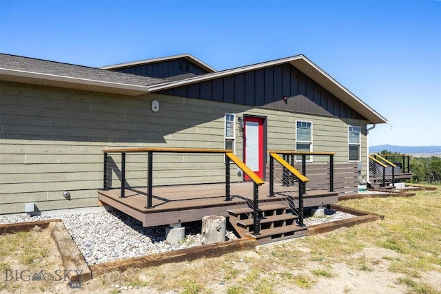 915 Point Of Rocks Rd, Whitehall, MT 59759 - view of exterior entry with a wooden deck and board and batten siding