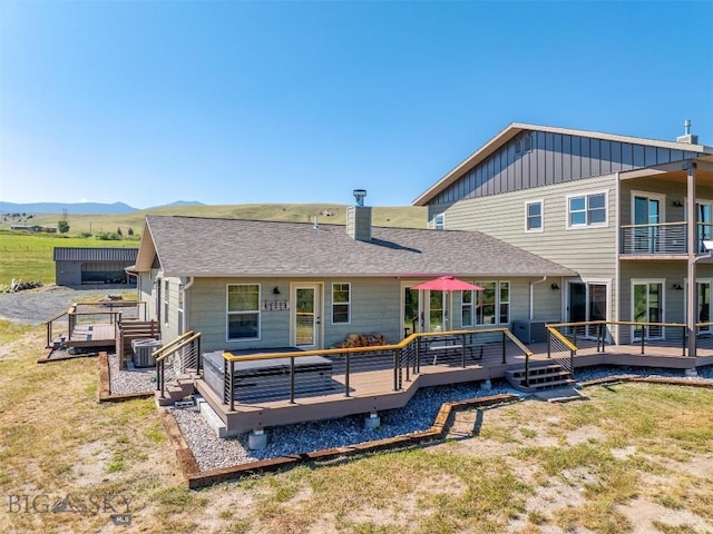 915 Point Of Rocks Rd, Whitehall, MT 59759 - rear view of property with a yard, a deck with mountain view, and a shingled roof