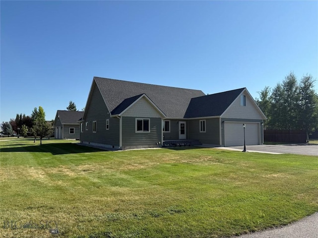 129 E Tobiano Trl, Belgrade, MT 59714 - single story home with concrete driveway, an attached garage, and a front lawn