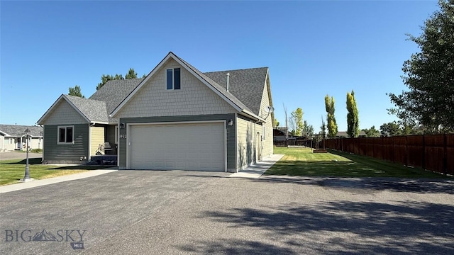 129 E Tobiano Trl, Belgrade, MT 59714 - view of front of home with an attached garage and driveway