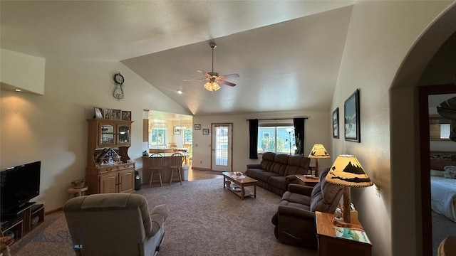 129 E Tobiano Trl, Belgrade, MT 59714 - living area featuring carpet flooring, ceiling fan, high vaulted ceiling, and arched walkways