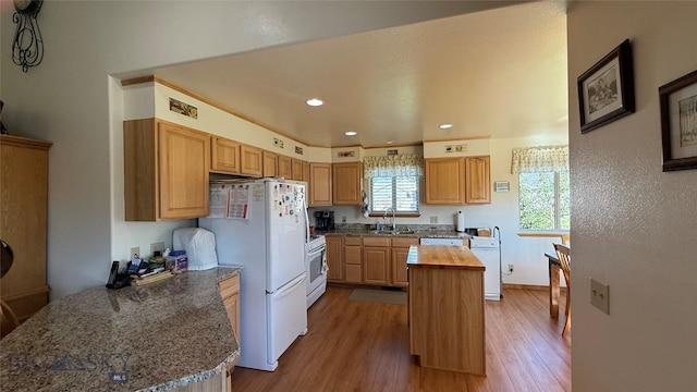 129 E Tobiano Trl, Belgrade, MT 59714 - kitchen featuring butcher block countertops, wood finished floors, white appliances, a center island, and recessed lighting