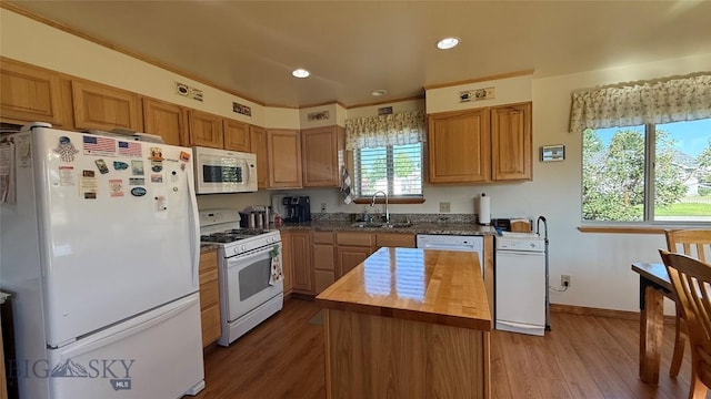 129 E Tobiano Trl, Belgrade, MT 59714 - kitchen featuring white appliances, butcher block counters, wood finished floors, a kitchen island, and recessed lighting