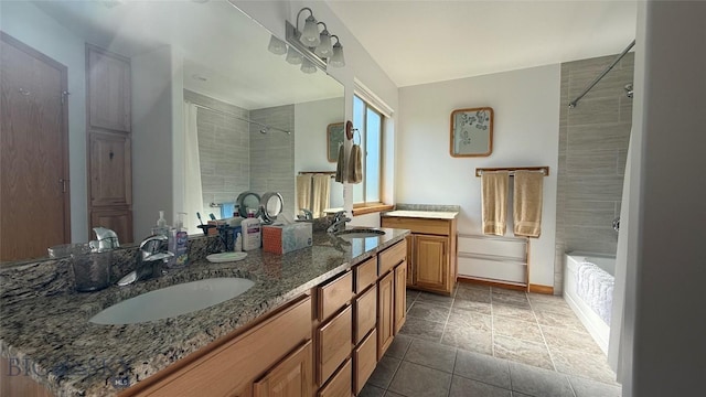 129 E Tobiano Trl, Belgrade, MT 59714 - bathroom with double vanity and tiled shower / bath combo