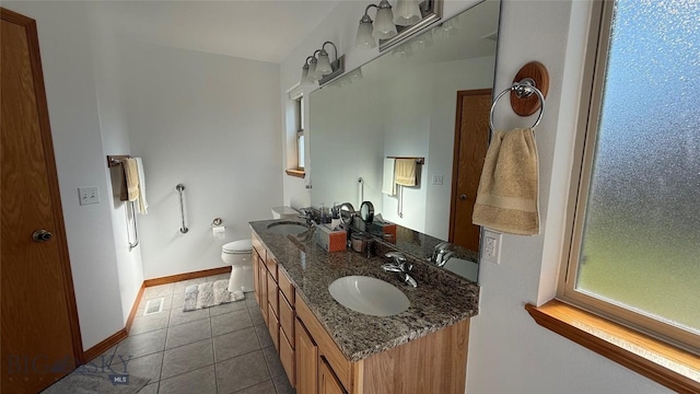 129 E Tobiano Trl, Belgrade, MT 59714 - full bath with double vanity and tile patterned flooring