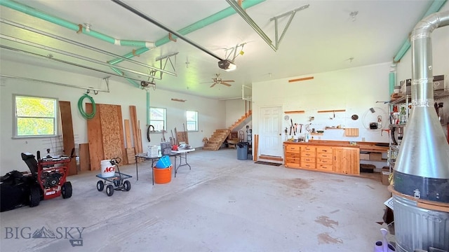 129 E Tobiano Trl, Belgrade, MT 59714 - garage featuring a workshop area and a garage door opener