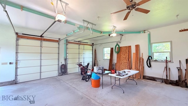 129 E Tobiano Trl, Belgrade, MT 59714 - garage with a garage door opener and ceiling fan