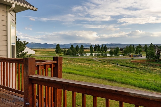 74 W Clara Ct, Bozeman, MT 59718 - wooden terrace with a water and mountain view and a view of rural / pastoral area