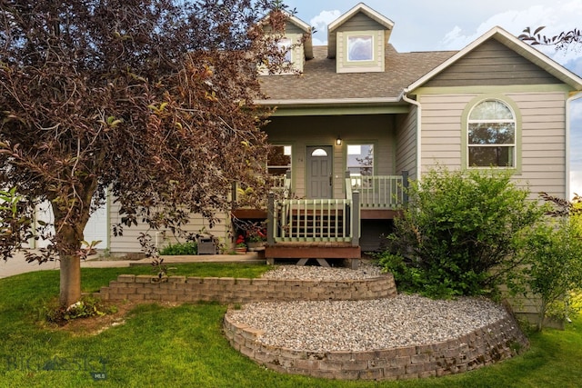 74 W Clara Ct, Bozeman, MT 59718 - view of front of home featuring a shingled roof and a front lawn