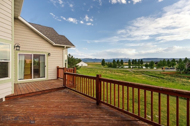 74 W Clara Ct, Bozeman, MT 59718 - wooden terrace with a mountain view and a yard