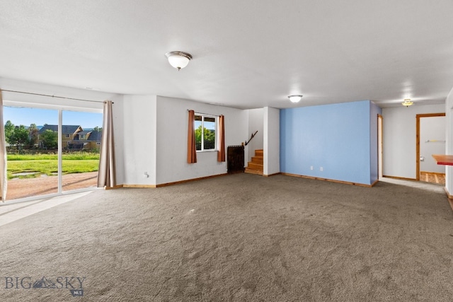 74 W Clara Ct, Bozeman, MT 59718 - carpeted spare room featuring baseboards and stairway