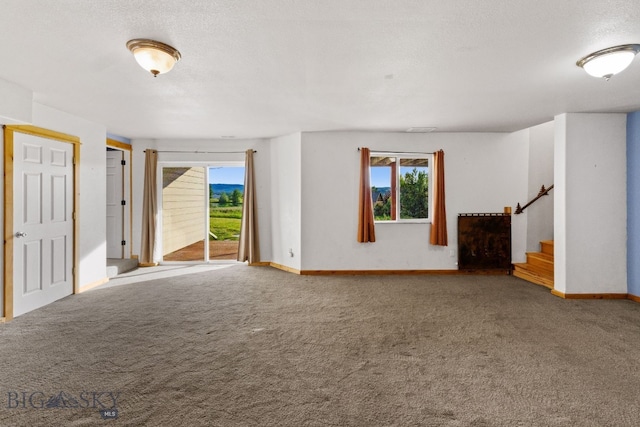74 W Clara Ct, Bozeman, MT 59718 - unfurnished living room with carpet floors and stairs