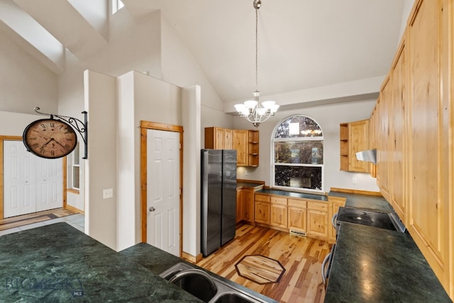 74 W Clara Ct, Bozeman, MT 59718 - kitchen featuring freestanding refrigerator, open shelves, dark countertops, extractor fan, and high vaulted ceiling