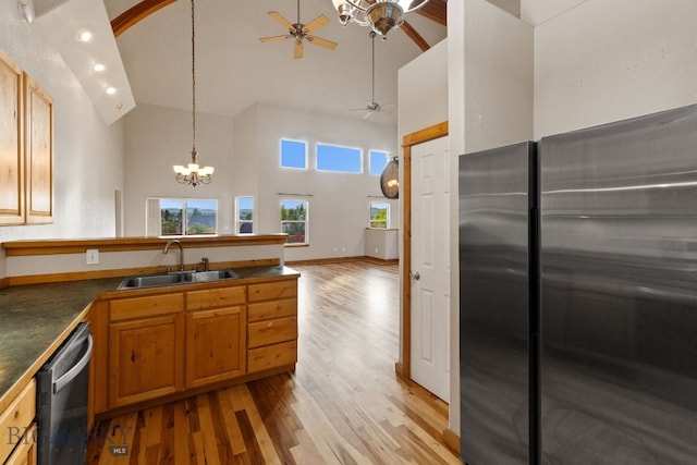 74 W Clara Ct, Bozeman, MT 59718 - kitchen featuring appliances with stainless steel finishes, high vaulted ceiling, ceiling fan, light wood finished floors, and a peninsula
