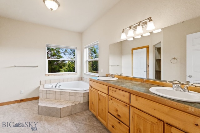 74 W Clara Ct, Bozeman, MT 59718 - bathroom with double vanity, a garden tub, and tile patterned flooring
