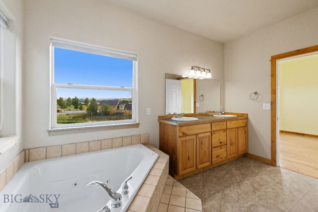 74 W Clara Ct, Bozeman, MT 59718 - bathroom with double vanity, a tub with jets, and tile patterned floors