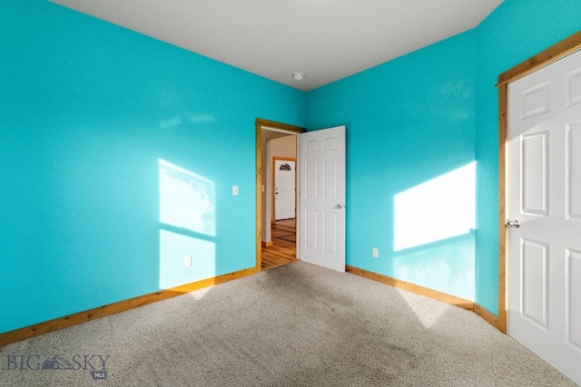 74 W Clara Ct, Bozeman, MT 59718 - unfurnished bedroom with carpet flooring and baseboards