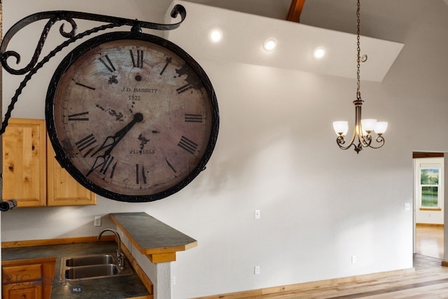 74 W Clara Ct, Bozeman, MT 59718 - detailed view of wood finished floors, a chandelier, dark countertops, decorative light fixtures, and recessed lighting