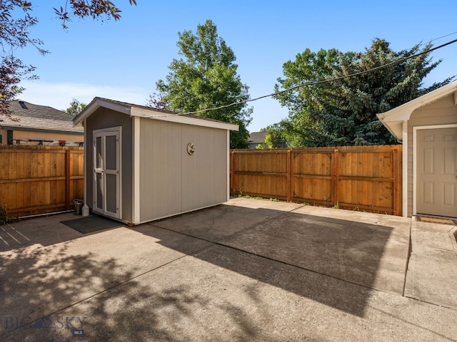 3455 W Cascade, Bozeman, MT 59718 - fenced backyard with a patio and a storage unit