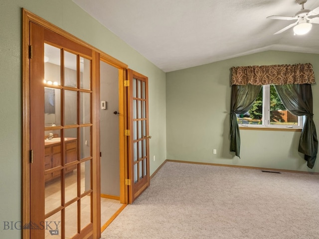 3455 W Cascade, Bozeman, MT 59718 - spare room with lofted ceiling, french doors, ceiling fan, and light colored carpet