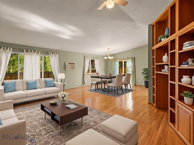 3455 W Cascade, Bozeman, MT 59718 - living room featuring a chandelier, light wood-style floors, a wall unit AC, lofted ceiling, and ceiling fan