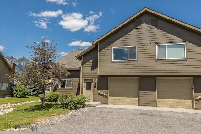 344 Candlelight Meadow Dr, Big Sky, MT 59716 - view of front of house with a garage and driveway