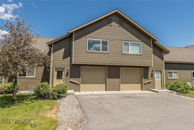 344 Candlelight Meadow Dr, Big Sky, MT 59716 - view of front of property with a garage and driveway
