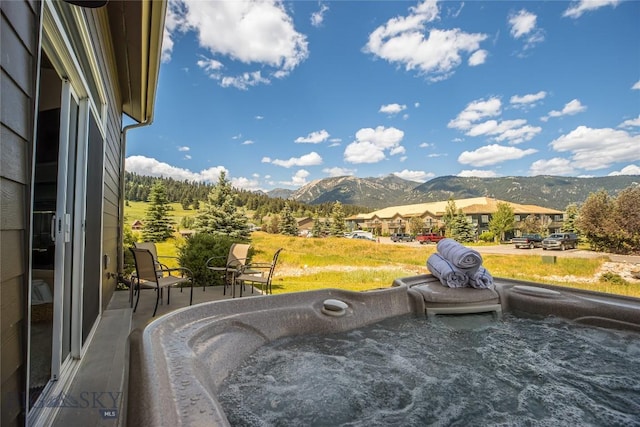 344 Candlelight Meadow Dr, Big Sky, MT 59716 - view of swimming pool with a mountain view and a hot tub