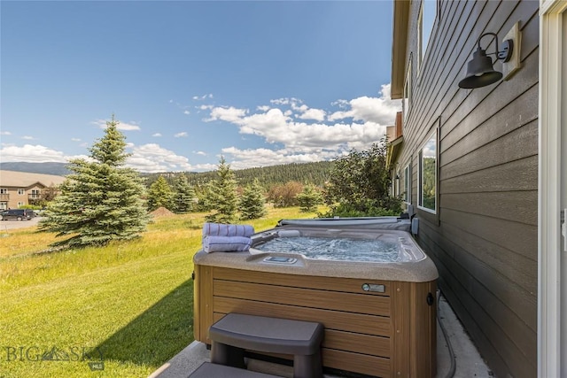 344 Candlelight Meadow Dr, Big Sky, MT 59716 - view of green lawn with a hot tub