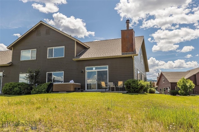 344 Candlelight Meadow Dr, Big Sky, MT 59716 - rear view of house featuring a chimney, a lawn, and a hot tub