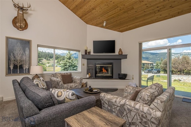 344 Candlelight Meadow Dr, Big Sky, MT 59716 - living room featuring carpet floors, a glass covered fireplace, wood ceiling, healthy amount of natural light, and high vaulted ceiling