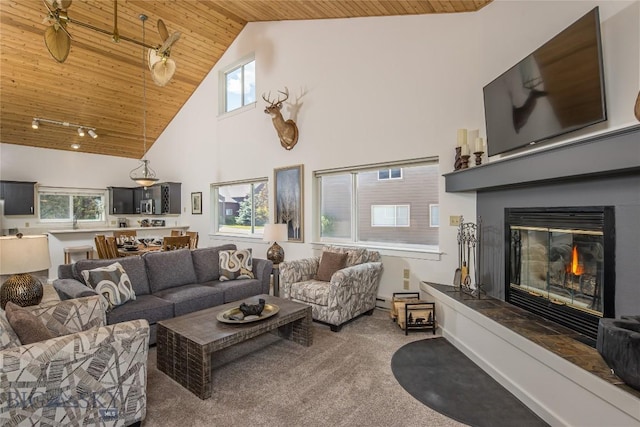 344 Candlelight Meadow Dr, Big Sky, MT 59716 - living room with wooden ceiling, high vaulted ceiling, carpet flooring, a glass covered fireplace, and healthy amount of natural light