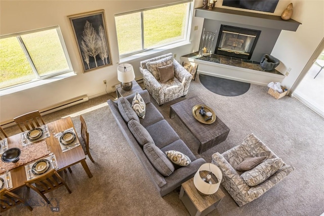 344 Candlelight Meadow Dr, Big Sky, MT 59716 - living room featuring carpet, baseboard heating, and a glass covered fireplace