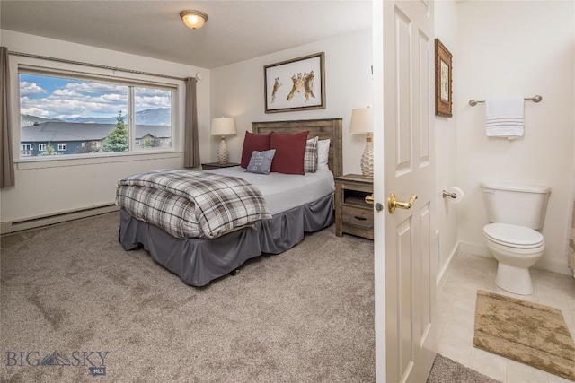 344 Candlelight Meadow Dr, Big Sky, MT 59716 - tiled bedroom with a baseboard heating unit and baseboards