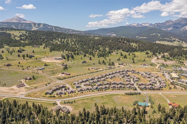 344 Candlelight Meadow Dr, Big Sky, MT 59716 - aerial view of property's location with mountains and a heavily wooded area