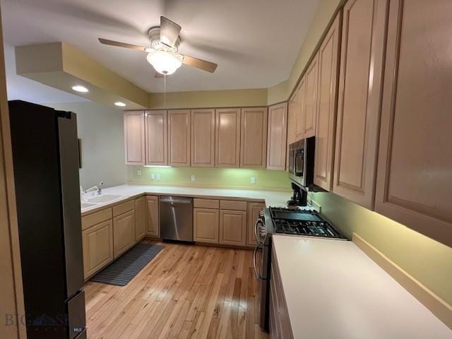 3 Gallatin Unit B, Bozeman, MT 59718 - kitchen with appliances with stainless steel finishes, light countertops, a ceiling fan, light brown cabinets, and recessed lighting