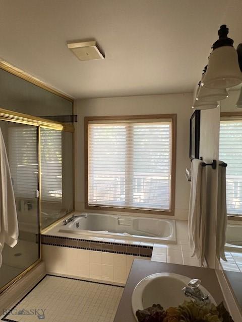 3 Gallatin Unit B, Bozeman, MT 59718 - full bathroom featuring a bath, a shower stall, and tile patterned floors